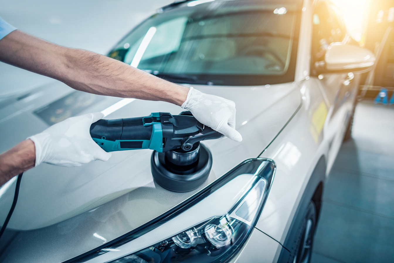 Worker Polishing Car