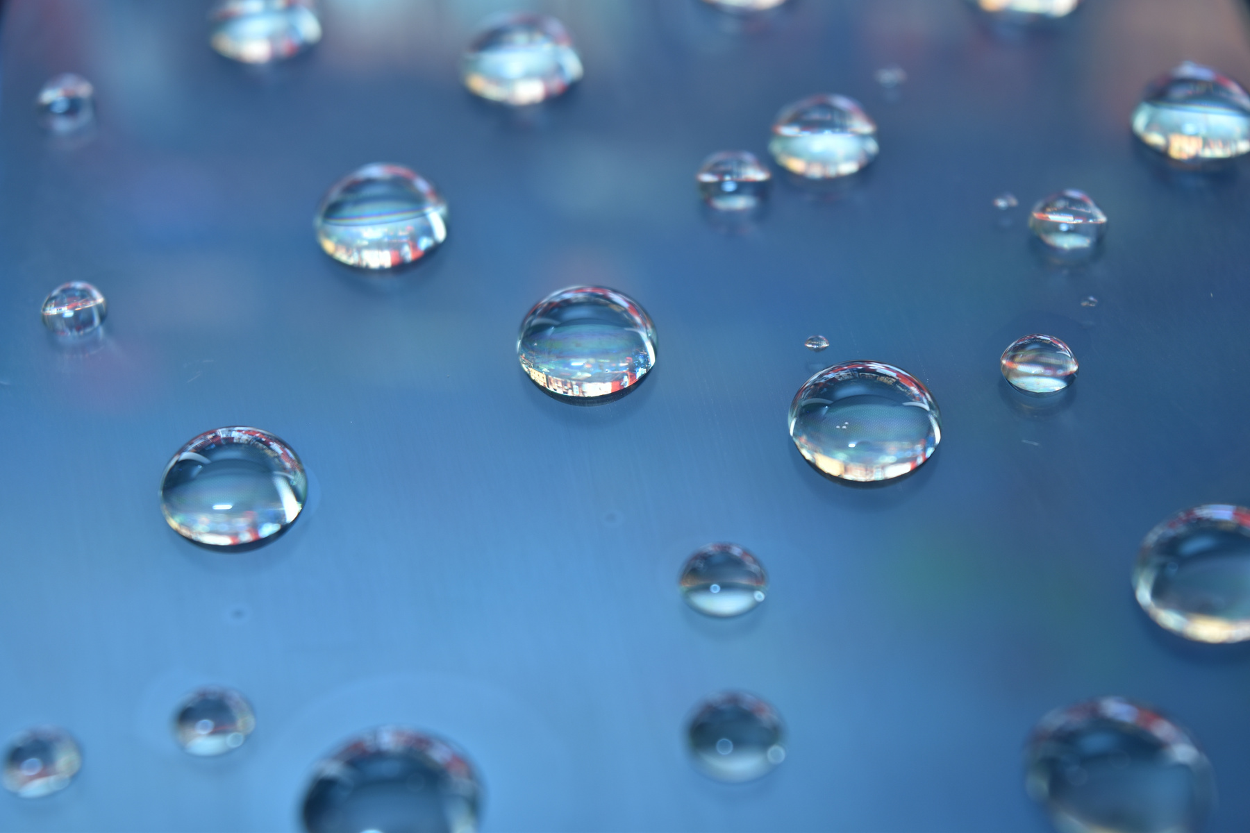 Water Droplets on a Blue Surface